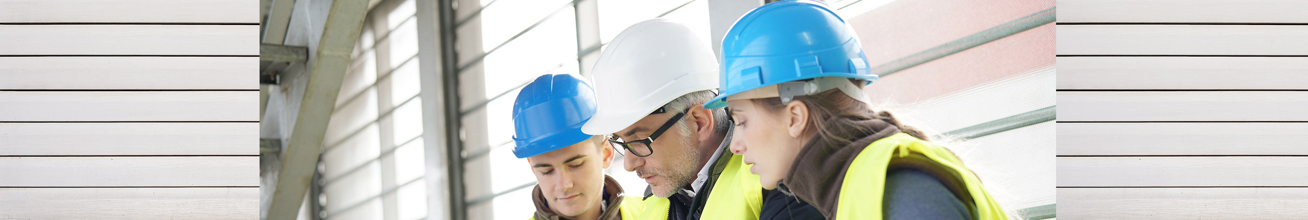 People engaged in a project wearing safety hats in a typical Tulalip Tribes work environment